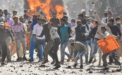 war of words between bjp and congress over delhi violence