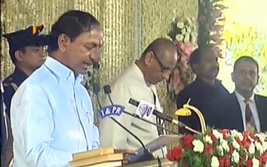 KCR takes oath as first CM