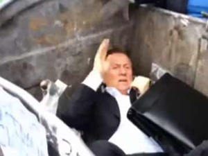 Ukraine activists throw member of parliament in bin near parliament