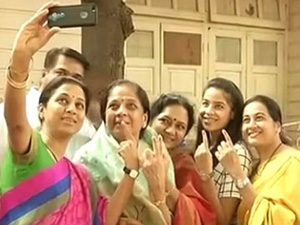 NCP leader pawar daughter Supriya Sule takes a group selfie after cast her vote Maharashtra Election polling