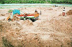 Sand mafia, transport, mining, business, artificial scarsity, robbery, straight robbery, syndicate